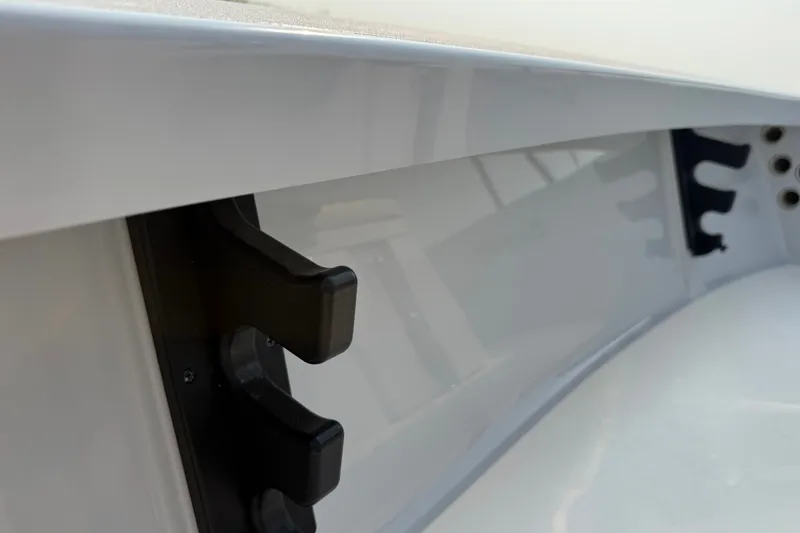 Slide: The Image of 2020 Maverick 18 HPX-V boat interior detail with rod holders. - 31