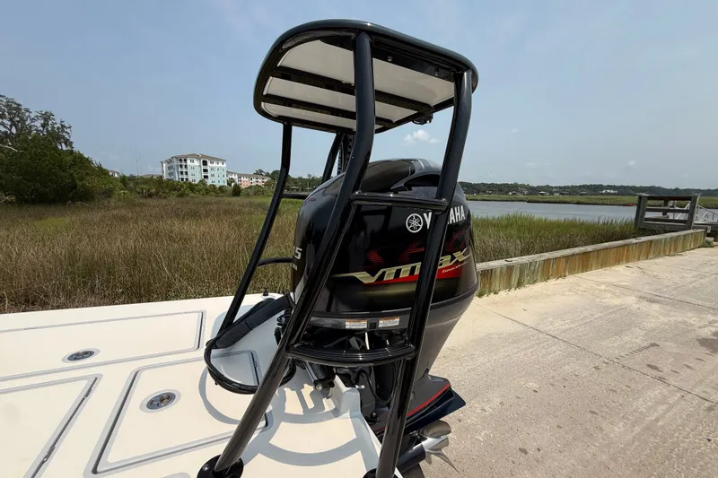Slide: The Image of 2020 Maverick 18 HPX-V boat with Yamaha engine, docked near a scenic waterfront. - 15