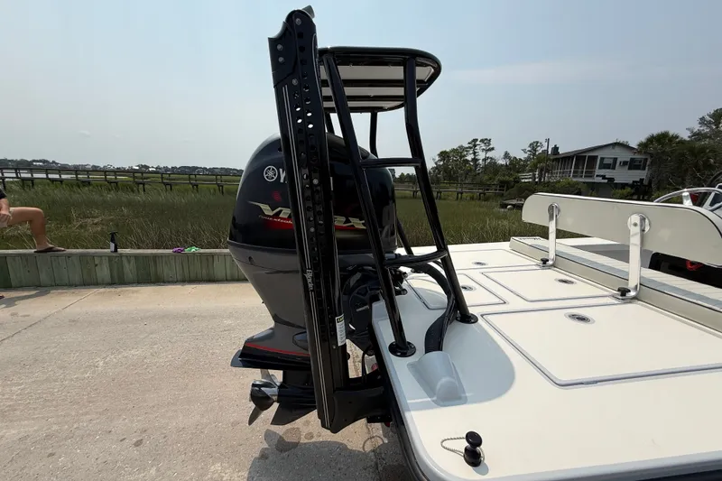 Slide: The Image of 2020 Maverick 18 HPX-V boat with Yamaha VMAX engine, docked near marshland. - 16