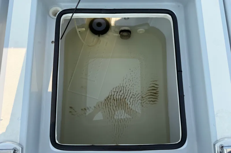 Slide: The Image of Livewell in 2020 Maverick 18 HPX-V boat, partially filled with water. - 33
