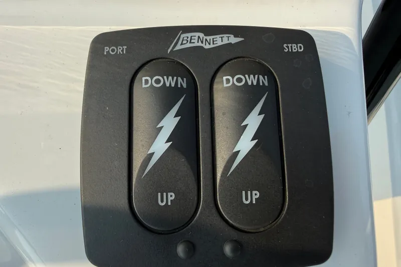 Slide: The Image of Bennett trim tab control panel on 2020 Maverick 18 HPX-V boat. - 41