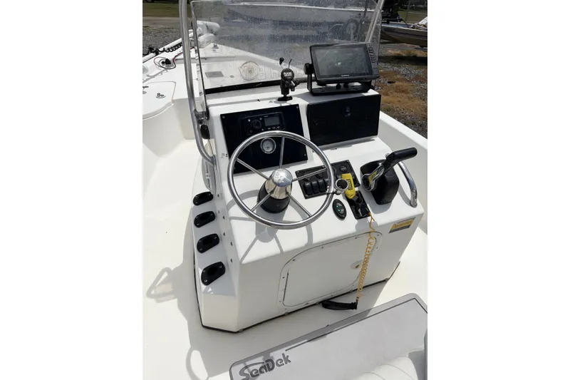 Slide: The Image of 2008 Blazer Bay 1960 Bay boat console with steering wheel and navigation equipment. - 6