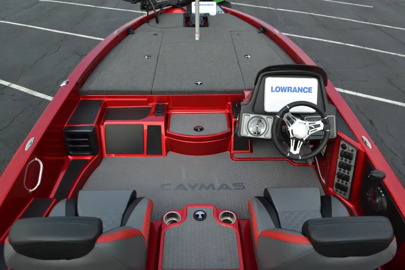 Slide: The Image of 2021 Caymas CX 19 boat interior with steering wheel and Lowrance display. - 6