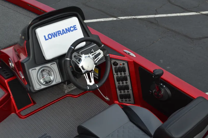 Slide: The Image of 2021 Caymas CX 19 boat cockpit with Lowrance display and steering wheel. - 7