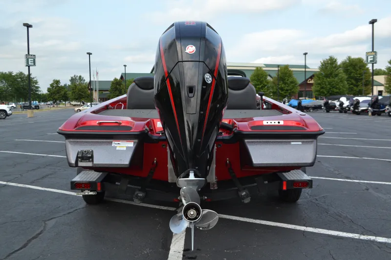 Slide: The Image of 2021 Caymas CX 19 boat with powerful outboard motor in a parking lot. - 4