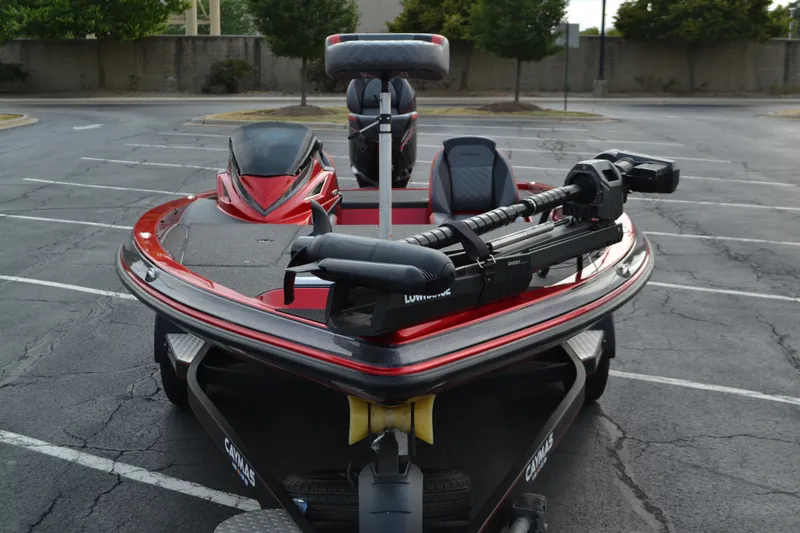 Slide: The Image of 2021 Caymas CX 19 bass boat in parking lot, featuring trolling motor and sleek design. - 3