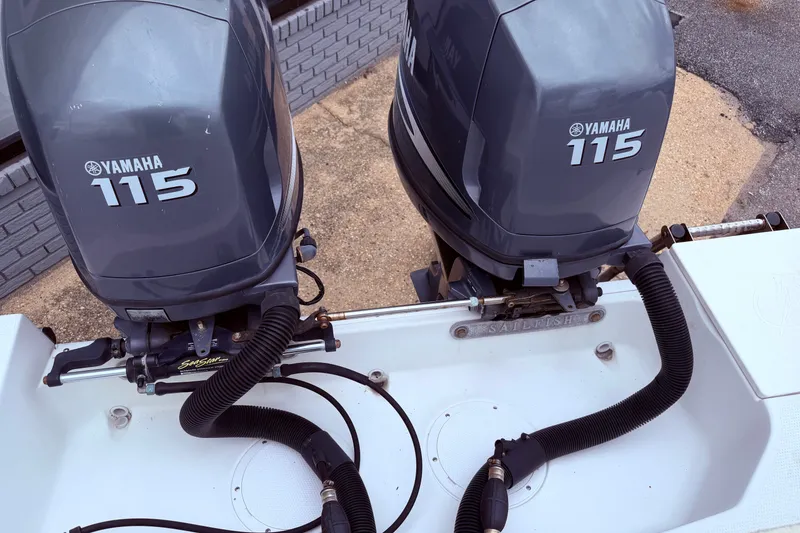 Slide: The Image of Twin Yamaha 115 engines on a 2007 Sailfish 2360 CC boat. - 4