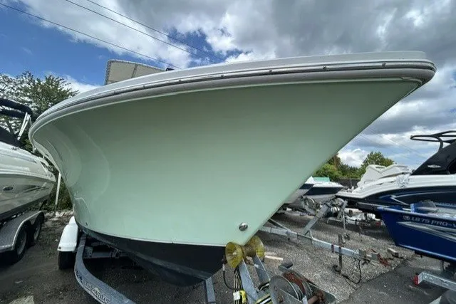 Slide: The Image of 2007 Sailfish 2360 CC boat on trailer under cloudy sky. - 18