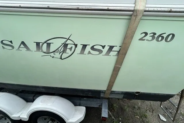 Slide: The Image of 2007 Sailfish 2360 CC boat on trailer, side view with logo and model number. - 20
