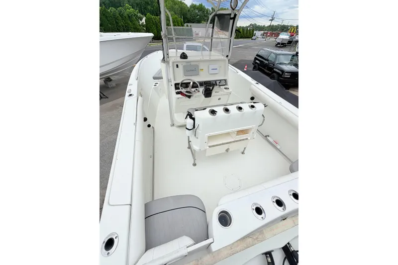Slide: The Image of 2007 Sailfish 2360 CC boat interior with steering console and seating. - 6
