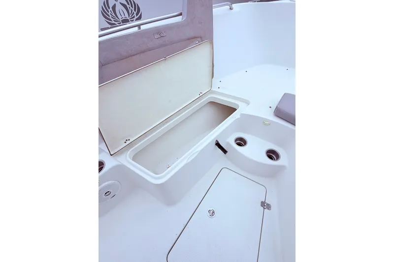 Slide: The Image of Open storage compartment on 2007 Sailfish 2360 CC boat deck. - 12