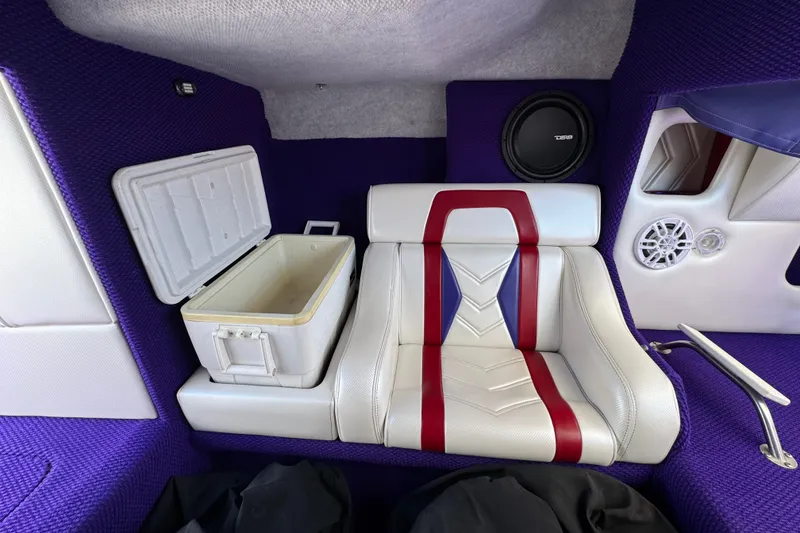 Slide: The Image of Interior of 2005 Ultimate Warlock 25 World Class boat with stylish seating and built-in cooler. - 14