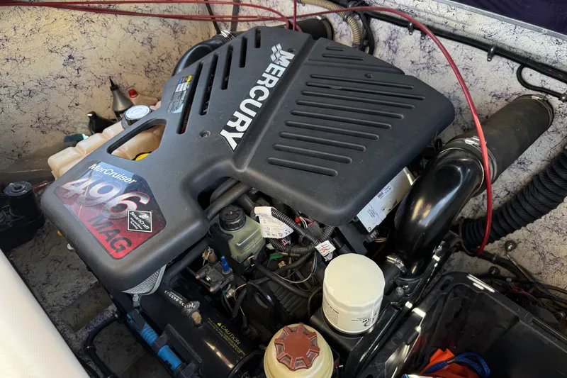 Slide: The Image of Engine of a 2005 Ultimate Warlock 25 World Class boat, featuring a MerCruiser 496 MAG. - 19