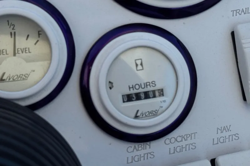 Slide: The Image of Close-up of Livorsi gauges on a 2005 Ultimate Warlock 25 World Class boat dashboard. - 25