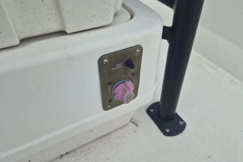 Slide: The Image of Control panel on a 2018 Mako Pro Skiff 19 CC Top Drive boat. - 11