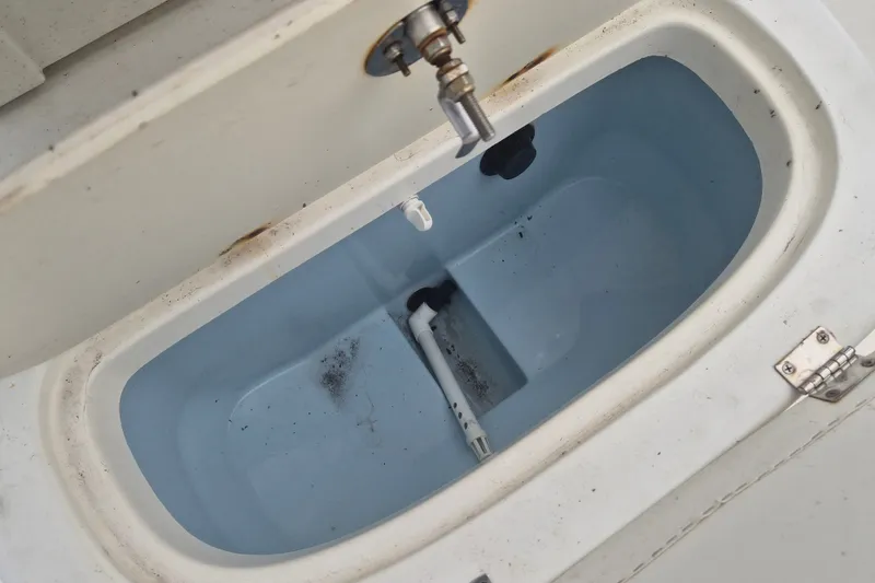 Slide: The Image of Livewell compartment of a 2018 Mako Pro Skiff 19 CC Top Drive boat. - 17