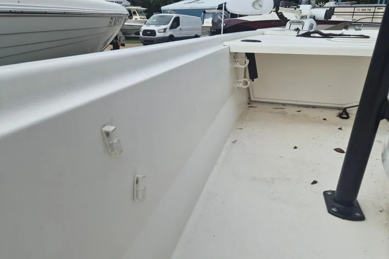 Slide: The Image of 2018 Mako Pro Skiff 19 CC Top Drive interior view, showcasing deck and fittings. - 21