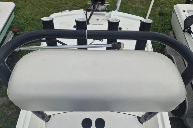 Slide: The Image of 2018 Mako Pro Skiff 19 CC Top Drive boat seat and rod holders. - 19