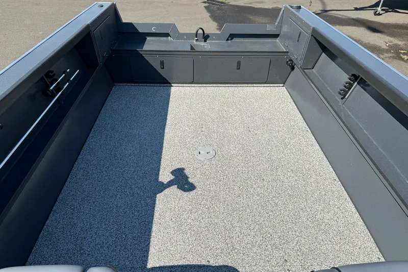 Slide: The Image of 2027 Alumaweld Adventurer 22 boat interior with spacious, durable deck and storage compartments. - 16
