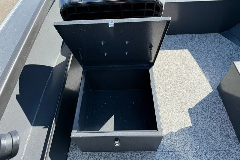 Slide: The Image of Open storage compartment on 2027 Alumaweld Adventurer 22 boat deck. - 11