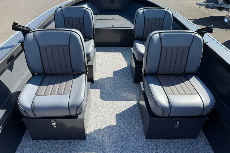 Slide: The Image of 2027 Alumaweld Adventurer 22 boat interior with four gray cushioned seats. - 9