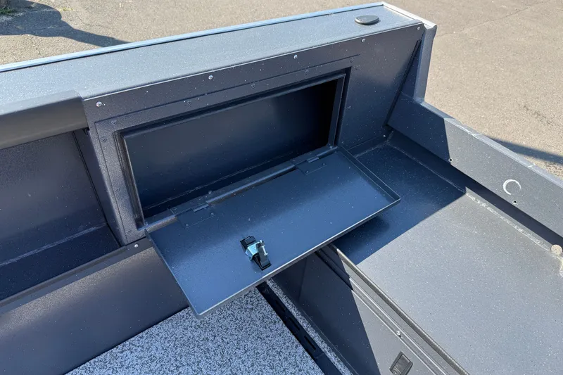 Slide: The Image of 2027 Alumaweld Adventurer 22 boat storage compartment with open hatch, showcasing interior space. - 23