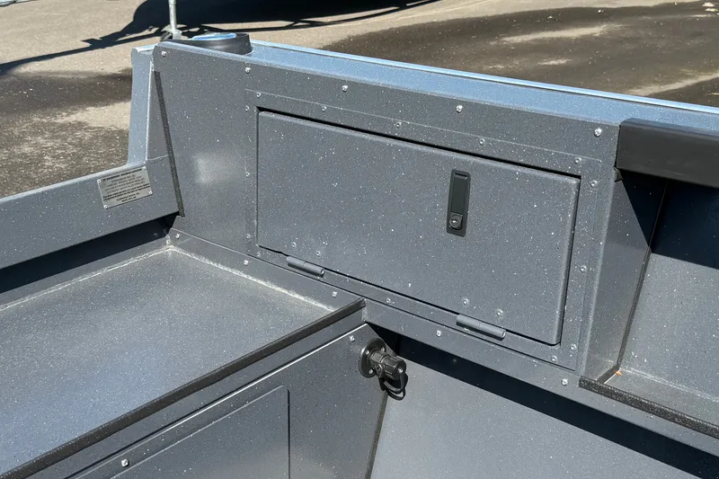 Slide: The Image of 2027 Alumaweld Adventurer 22 boat interior with storage compartment and sleek design. - 18
