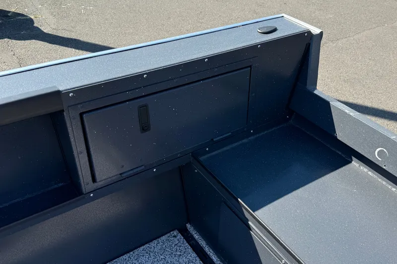 Slide: The Image of 2027 Alumaweld Adventurer 22 boat interior with storage compartment and sleek design. - 17