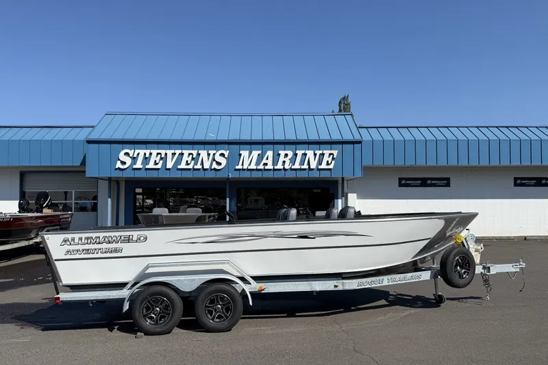 Slide: The Image of 2027 Alumaweld Adventurer 22 boat on trailer at Stevens Marine dealership. - 1