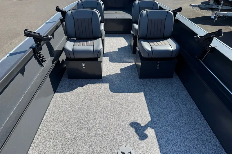 Slide: The Image of 2027 Alumaweld Adventurer 22 boat interior with four seats and rod holders. - 14