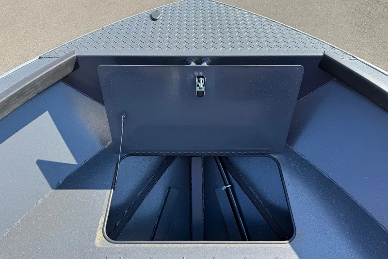 Slide: The Image of 2027 Alumaweld Adventurer 22 boat storage compartment with open hatch, showcasing interior space. - 8