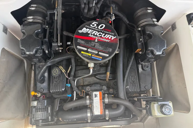 Slide: The Image of Engine of 2003 Four Winns 190 Horizon boat, featuring a 5.0L MerCruiser motor. - 21