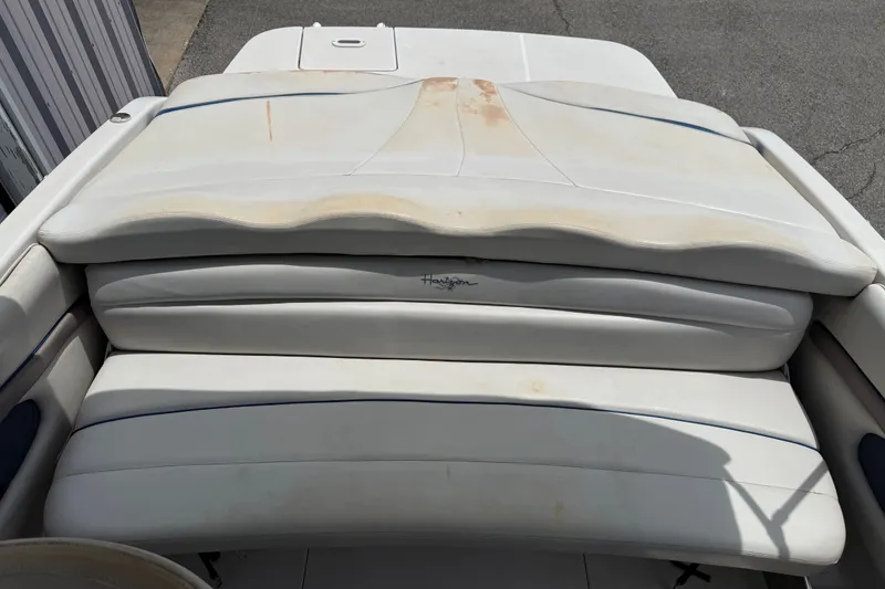 Slide: The Image of 2003 Four Winns 190 Horizon boat interior with white cushioned seating. - 11