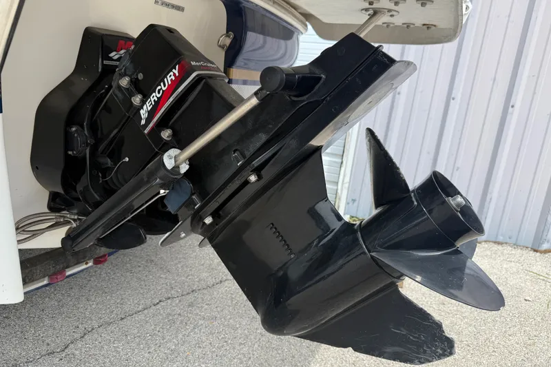 Slide: The Image of 2003 Four Winns 190 Horizon boat with Mercury outboard motor detail. - 3