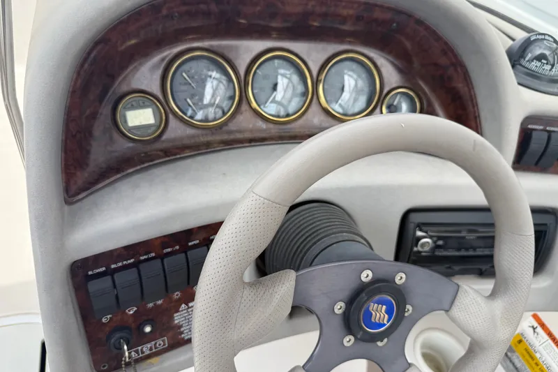 Slide: The Image of 2003 Four Winns 190 Horizon dashboard with steering wheel and instrument panel. - 17