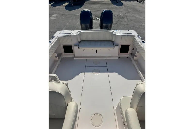 Slide: The Image of 2004 Grady-White Gulfstream 232 boat interior with seating and storage compartments. - 17