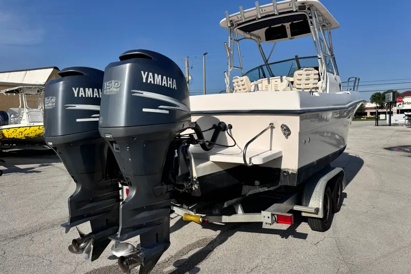 Slide: The Image of 2004 Grady-White Gulfstream 232 boat with dual Yamaha 150 engines on trailer. - 9