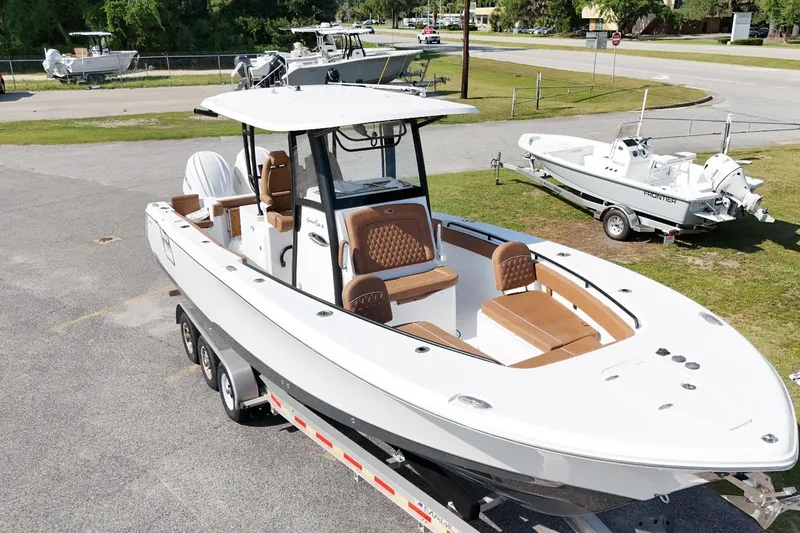 Slide: The Image of 2027 Sea Hunt Gamefish 28 Forward Seating boat on trailer, featuring sleek design and spacious seating. - 6