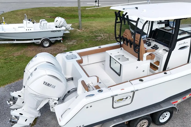 Slide: The Image of 2027 Sea Hunt Gamefish 28 boat with Yamaha engines, featuring forward seating and modern design. - 10