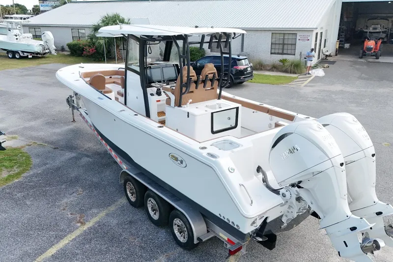 Slide: The Image of 2027 Sea Hunt Gamefish 28 Forward Seating boat with dual Yamaha engines on trailer. - 8