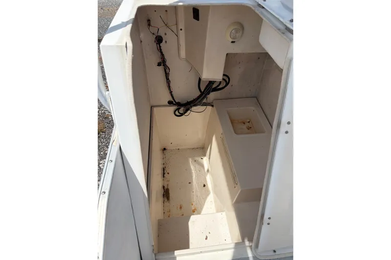 Slide: The Image of Interior view of a 1998 Beachcat 19 boat, showing wiring and compartments. - 7