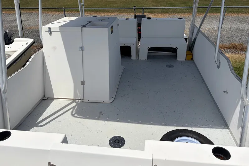 Slide: The Image of 1998 Beachcat 19 boat interior with storage compartments and seating. - 5