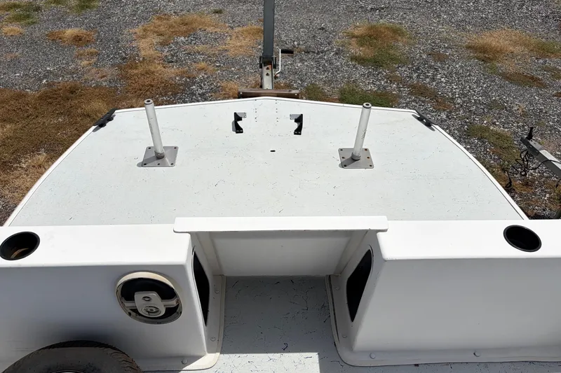 Slide: The Image of Rear view of a 1998 Beachcat 19 boat on a gravel surface. - 6
