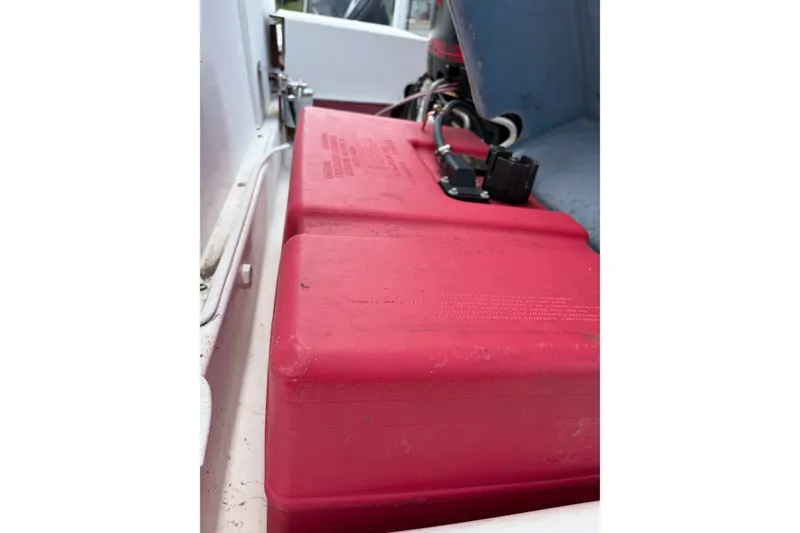 Slide: The Image of Red fuel tank on a 1998 Beachcat 19 boat interior. - 4