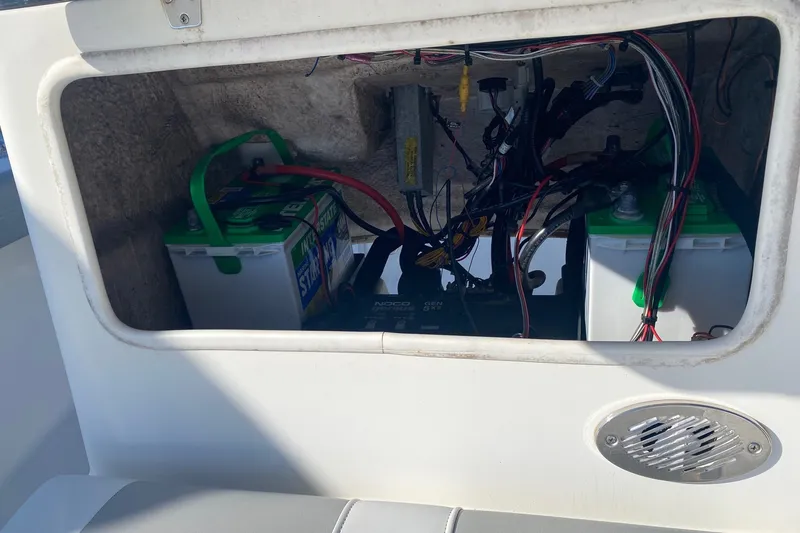 Slide: The Image of Interior view of a 2018 Mako 204 Center Console boat's battery compartment. - 8