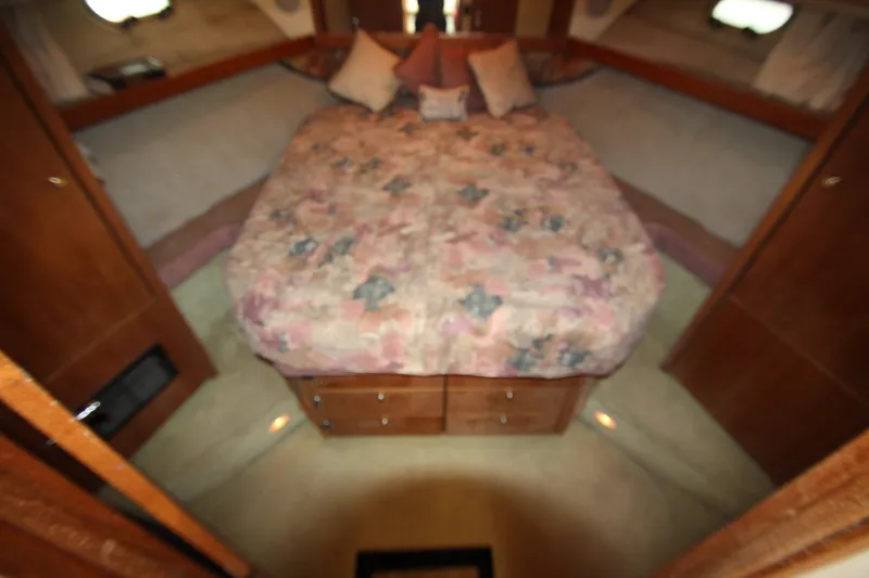 Slide: The Image of Cozy bedroom interior of 1996 Bayliner 3988 Command Bridge Motoryacht with floral bedding. - 42