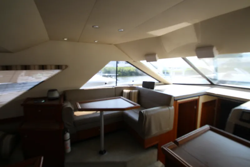 Slide: The Image of Interior of 1996 Bayliner 3988 Command Bridge Motoryacht with seating and table. - 27