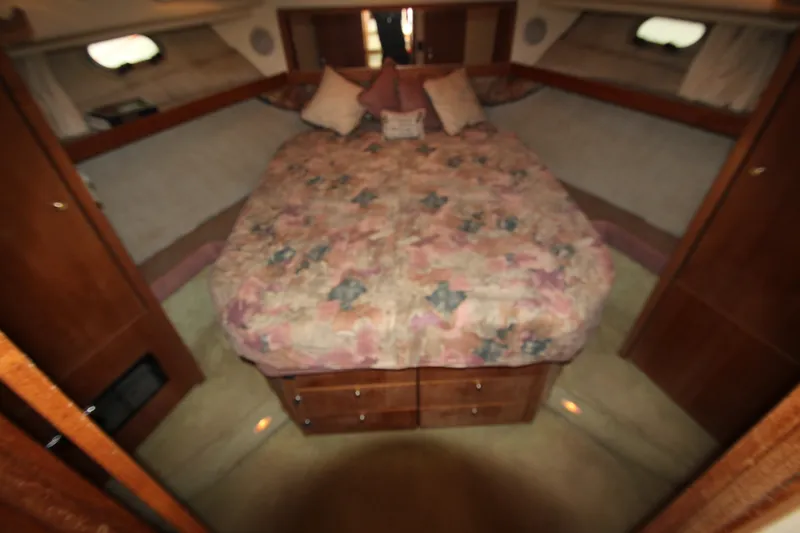 Slide: The Image of Cozy bedroom in 1996 Bayliner 3988 Command Bridge Motoryacht with floral bedding. - 44