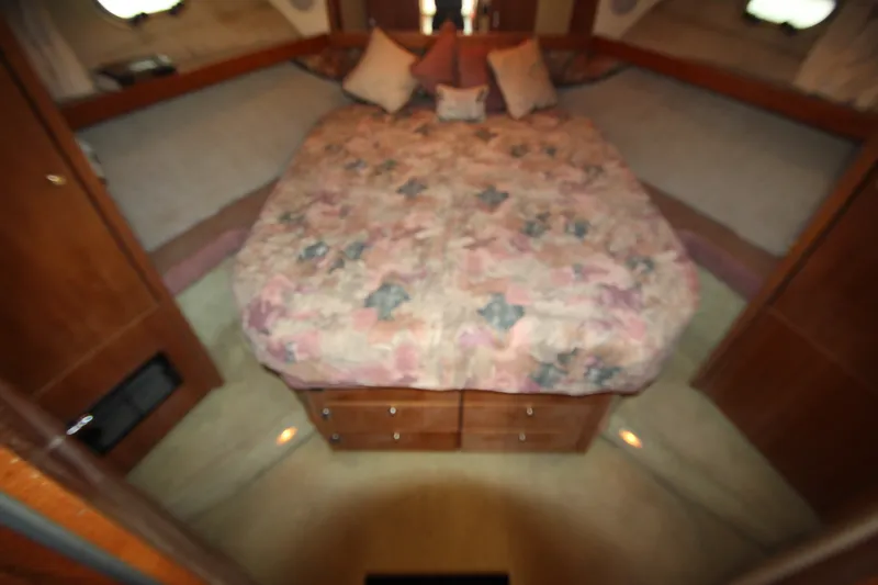 Slide: The Image of Cozy bedroom in 1996 Bayliner 3988 Command Bridge Motoryacht with floral bedding. - 43