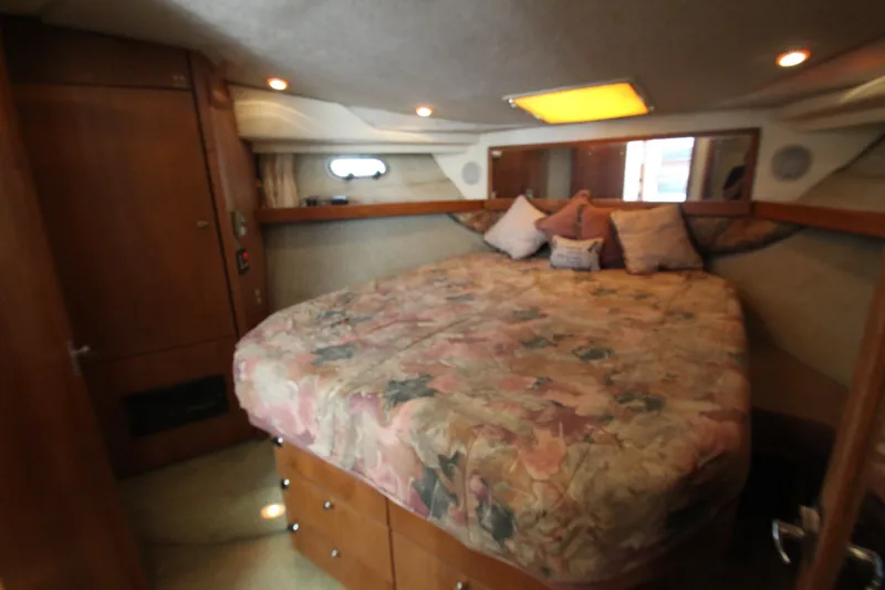 Slide: The Image of Cozy bedroom in 1996 Bayliner 3988 Command Bridge Motoryacht with floral bedding. - 45